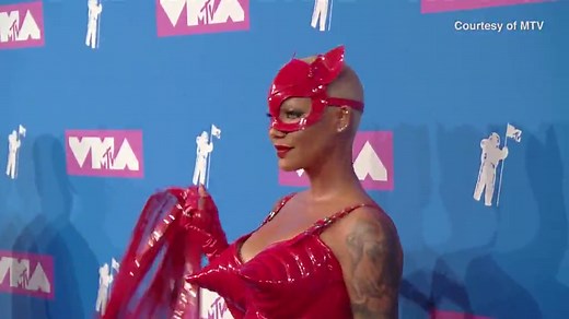 Amber Rose in devil costume with whip & fishnets to the VMAs
