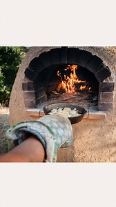 The cob oven is one of the many wood-fired cooking units in Quail Springs. It works by: 1) Utilizing the thermal mass of the cob to store heat. 2) That heat is what you're cooking with (not the fire itself). 3) A fire gets the oven hot, but then the fire is pulled out and the food goes in. 4) With the door on, the oven will stay hot for hours. How fun is that? Have you ever cooked with a cob oven? Learn more here: https://cmn.to/f858a #coboven #permaculture | Commune | Facebook