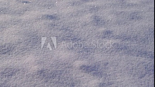 Snow cover close-up. Snow texture. The snow lies in a smooth, even layer, close-up. Snow background