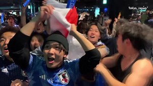 Japan fans celebrate after stunning win over Spain