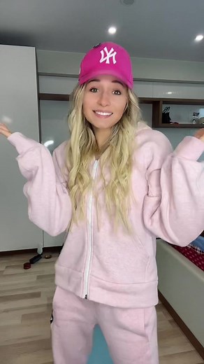 Performing Energetic Moves in Pink Tracksuit