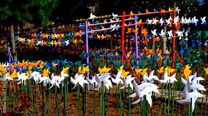 Travel and Vacation Footage. Landscape video of massive colorful pinwheel spinning in an amusement park. The pinwheel that adorns the tourist park. High Quality 4k Videos