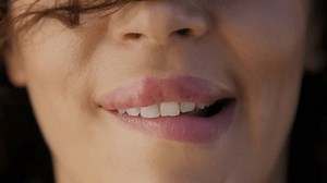 Collage of sensual women biting and licking sexy lips. Close up young women faces biting plump lips. Attractive woman lips and mouth closeup. Diverse group of faces healthy skin close up background 4K