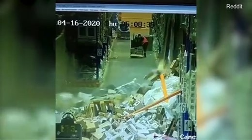 This is when a sleeping warehouse worker drives a low-level picking truck into a shelf, sending the whole lot tumbling down. The clip begins with the man driving down the workshop aisle, but because he is asleep, he begins veering towards a stack of shelves. As soon as he touches the rack, it jolts him awake, and he looks up to see the items starting to fall over his head. He then wakes up quickly and shuffles to the side as the falling boxes start to have a domino effect on the rest of the shel