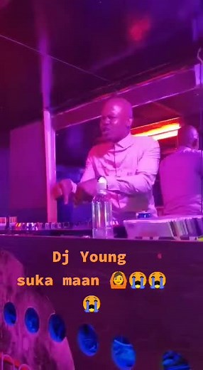 DJ Live Performance at Nightclub with Vibrant Atmosphere