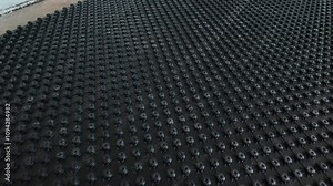 System of underfloor heating. Installation of a heat flooring system. Modern heating system in a new home