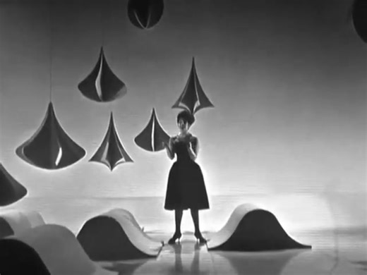 Before The Beatles conquered the world, Alma Cogan was one of the brightest stars of the British music scene. In 1960, with her clear voice and charming performance style, she recorded a cover of one of the most classic songs in history, "Begin the Beguine." Although not a major hit, this version still showcased Alma Cogan's versatility, as she breathed new life into a long-standing masterpiece. The song was written by the great American composer Cole Porter. Cole Porter's original version was c