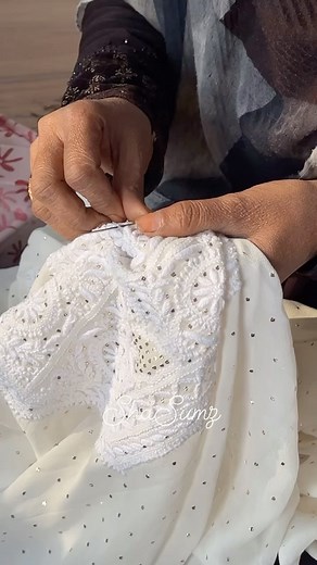 ShaSumz Karigar hand embroidering fabric with Mukaish work. Mukaish / Baadla is a metal embroidery, where you take little strands of metal and twist them into patterns and little dots with your hand—either to adorn chikankari outfits, or to form complete motifs and textiles of the mukaish jaal. The base fabrics can range from soft georgettes and chiffons to sturdy raw silks. #mukaish #mukaishwork #shasumz #shasumzchikankari #handembroidery #handembroidered #chikankari #chikankaribyshasumz #chika