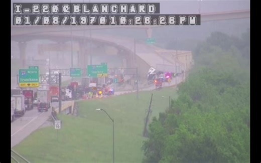 An 18-wheeler has wrecked on I-220 E at I-49, partially hanging off the exit ramp. | KTBS 3 News