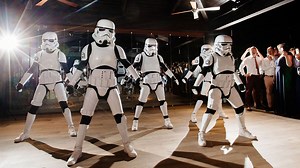 A bride surprised her wedding guests by dancing as a Star Wars STORMTROOPER alongside Britain's Got Talent sensations Boogie Storm for her first dance. | Storytrender