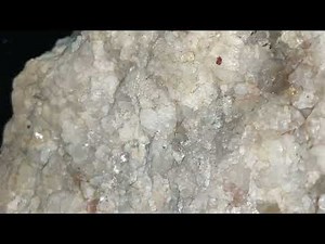 PEGMATITE MINERAL CLOSEUP - QUARTZ FELDSPAR AND MICA