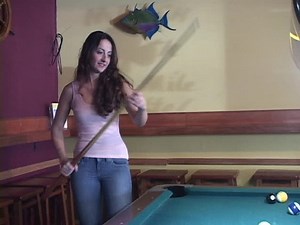 Young lady jumping with joy in pool bar