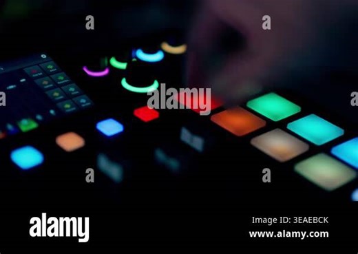 DJ sampler controller glowing pads finger pressing music production equipment Electronic beatmaker console colorful buttons dark workspace sound engineering technology interface audio mixer Stock Video Footage - Alamy