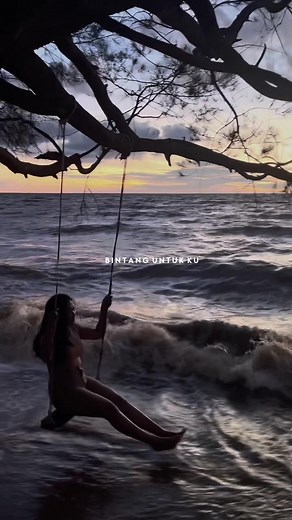 Sunset Swinging at the Beach: A Serene Moment