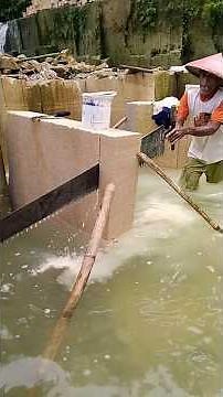 Limestone Quarrying.Using a manual saw, the process of limestone Quarrying to make bricks..