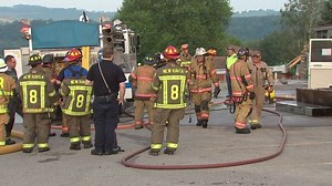 Fire damages social club across street from local fire department