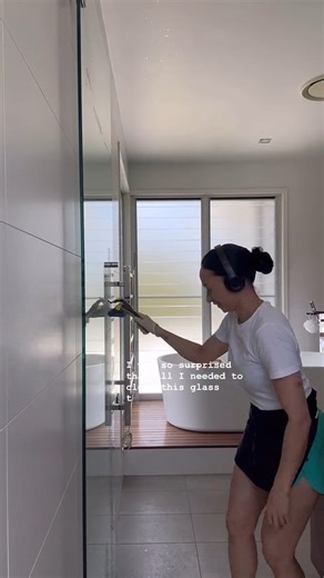 Headphones on, Window Multi Tool in-hand - Centered Cleaning means business. | ENJO Australia