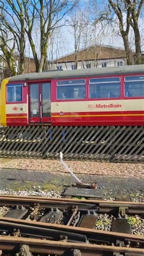 The Class 144 DMU 144011 departs Ingrow West Station
