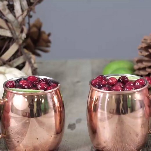Cranberry Moscow Mules will make your holidays merry! Full recipe: http://ctrylv.co/jNvCaGt | Country Living Magazine