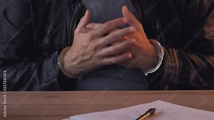 Crime suspect during an interview in police interrogation room