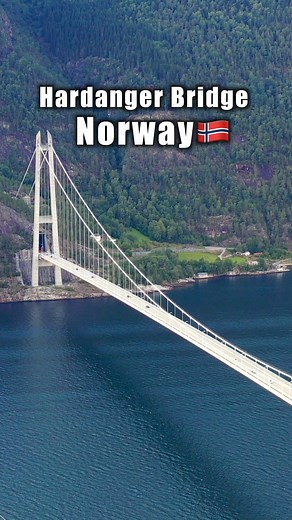 Experience breathtaking views as the car drives across the Hardanger Bridge, captured from both the road and drone above the stunning fjord. Watch the famous blue tunnels before and after the bridge, creating a futuristic journey through one of Norway’s most spectacular engineering marvels! | CrazyTroll - Nordic Stories