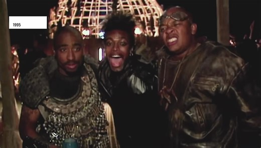 The Archives on Instagram: "Tupac's "California Love" video directed by Hype Williams shot November 10-13, 1995 at El Mirage Desert (Victorville, CA), channeling Mad Max Beyond Thunderdome into post apocalyptic 2095 West Coast wasteland revival, first single off All Eyez on Me post jail Death Row welcome. Post nuke tribe rolls up on Thunderdome style fortress; Clifton Powell as warlord "Monster," Chris Tucker MC hype, Tony Cox dwarf guard, Roger Troutman talk box warrior Pac emerges golden armou