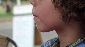 Young Boy Eating Popsicle