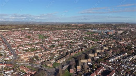 Queen Alexandra Hospital Portsmouth reveal drone footage of the hospital and surrounding housing in bright sunshine on clear day with views of the hills and countryside beyond