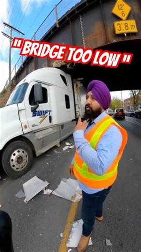 Swift semi truck gets stuck under bridge