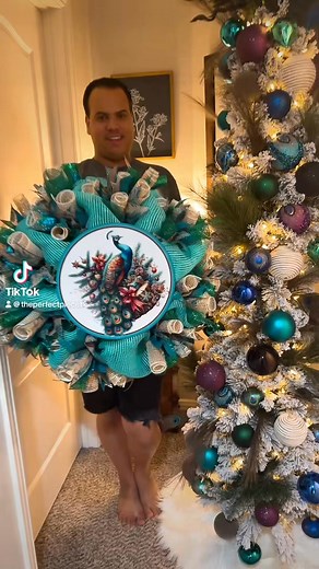 🎄✨ Just finished this stunning peacock-themed Christmas mesh wreath! 🦚 The centerpiece features a gorgeous peacock sign, surrounded by vibrant peacock ribbons and colors that truly make it stand out. Perfect for adding a unique touch to your holiday decor! 🌟💚💙 Who else loves incorporating a little color into their Christmas celebrations? #PeacockWreath #ChristmasDecor #HolidayCheer #ThePerfectPieceTx | The Perfect Piece Tx