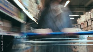 Time lapse of the shopping cart moving between various aisles and section in the big supermarket. Woman shopping in a grocery store