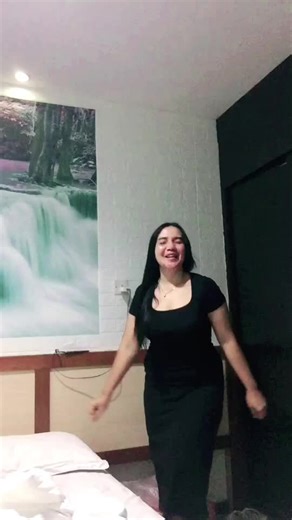 Elegant Bedroom Dance Performance in Black Dress