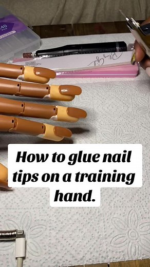 Beginner's Guide to Gluing Nail Tips on a Training Hand