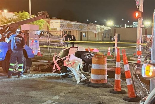 2 hospitalized after vehicle crashes into Lansing work site
