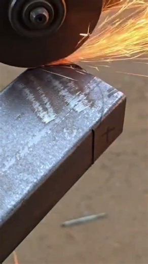 cutting the grey metal precisely using a professional electric angle grinder machine activity day