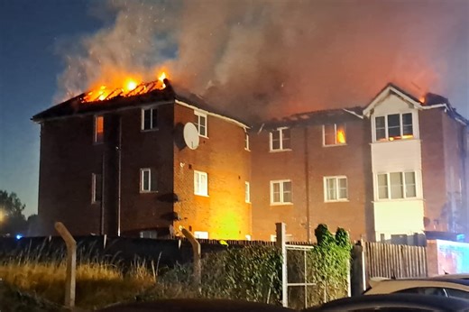 70 firefighters tackle early-morning blaze at two flats