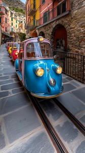 7.7K views · 140 reactions | Ever dreamed of travel through Italy in true Vespa style?  Check out these Vespa-style mini trains winding through Cinque Terre’s colorful streets. A stunning mix of imaging and art, capturing la dolce vita with every turn! ✨#Travel #Imaging #Art #CinqueTerre #VespaStyle #Italy | Cypriot.ai | Facebook