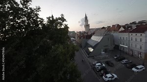 This stunning aerial footage showcases the captivating beauty of Opole, Poland, a hidden gem of Central Europe. The video takes you on a mesmerizing journey above the citys historic center, revealing