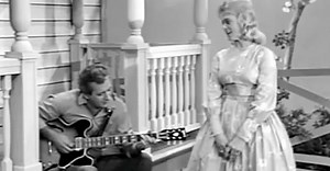 She Looks Lovingly At Her Man While She Sings, But Listen Closely To Her Lyrics... Amazing!