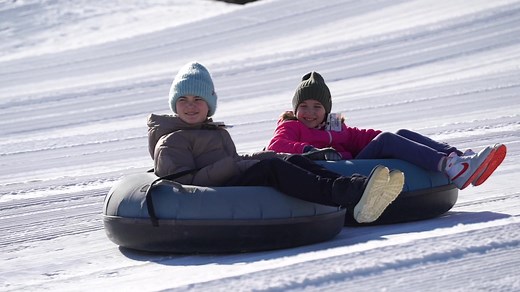 Ultimate wintertime fun! Enjoy snow tubing with the whole family. Even with the warmer temperatures, there are plenty of laughs to be had in the snow! Visit perfectnorth.com/snow-tubing-tickets for more information. | Perfect North Slopes