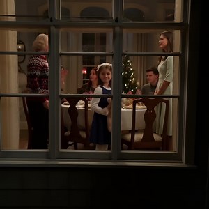 I never told my mother-in-law that my daughter—the child she treated like an inconvenience—held the power to cut her out of our lives completely. At Christmas, she showered the other grandchildren with envelopes of cash and brand-new iPads. Then she handed my daughter a flimsy gift bag with a cheap candle inside. The tag read: “To Travis’s Girl.” The room froze. My seven-year-old rose from her chair in her gold dress, calm as royalty. “Grandma,” she said evenly, “Dad told me to give you this if 