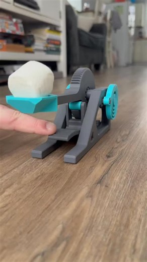 Macshay Creations on Instagram: "Shot-by-shot remake of our viral pumpkin catapult... but make it winter ❄️🎯 Close-ups of the mechanical magic as we: ✨ Cock back the spring-loaded arm ✨ Load the marshmallow ✨ Launch it perfectly into hot cocoa This beauty prints with ZERO supports, no glue/hardware and features working gears, printed-in-place bearings, and a smooth trigger mechanism we tested 50+ times. 🎁 FREE files dropping SUNDAY! Follow so you don't miss the release! #3DPrinting #3DPrinted 