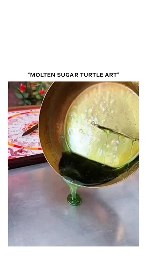 Zeeldom on Instagram: "The post showcases an 18-second clip of a traditional sugar painting artist crafting a green turtle by pouring and shaping molten sugar with ladles and spatulas on a metal surface, framed by festive Chinese decorations. Known as tánghuà, sugar painting dates back to China’s Tang Dynasty and is a folk art used to create edible figures; the turtle represents longevity and the mythical Black Tortoise, Xuanwu, adding cultural symbolism to the craft. Strong engagement from Indo