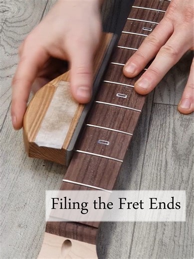 Filing down the fret ends #BushdogGuitars #production #maple #rosewood #fretboard #pjdguitars #guitar #closeup #fretwork #fretting #fret #guitarwork #guitartech #guitarmaintenance #guitarneck