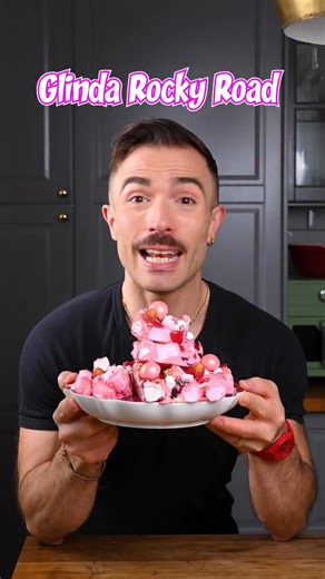 If Glinda ever had to whip up a Christmas dessert… this would be her pink, glittery, “defy gravity” Rocky Road 🎀✨ Sweet, fruity, and fabulously extra — just like our favourite Good Witch. 💖✨ 💗 Ingredients * 140g raspberry liquorice * 90g dried cranberries * 400g white chocolate * 3–4 drops pink food colouring * 60g toasted coconut * 20g freeze-dried raspberry & apple mix (or just raspberry) * 90g raspberry candy * 180g marshmallows * Edible glitter ✨ * 10-15 mini marshmallows to decorate * sp