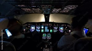 Pilots preparing jet airliner for take off during night, cockpit timelapse