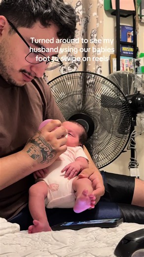 Dad Uses Baby's Foot to Swipe Reels — Funny Parenting Moment