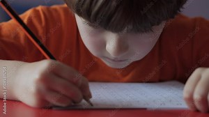 School Boy Practicing Writing Numbers at Home. Child Working on His Homework. Little Boy Studying Learning at Home. Child, Learning Doing Math for Education, Making Homework Numbers in His Room. Stock Video