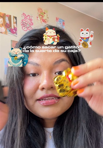 Cómo sacar un gatito de la suerte chino de su caja