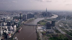 Aerial view of the Ba Son Bridge over the Saigon River in Ho Chi Minh City, Vietnam, with the view of Landmark 81 building, tower in the background